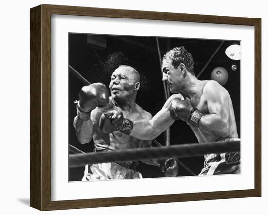 Rocky Marciano Landing a Punch on Jersey Joe Walcott, Sept. 23, 1952-null-Framed Photo