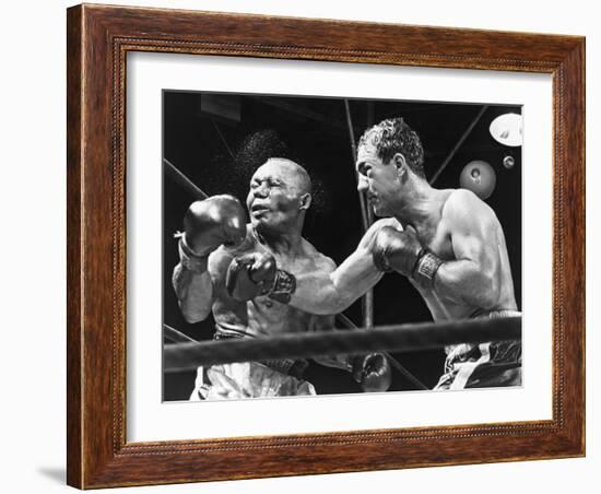 Rocky Marciano Landing a Punch on Jersey Joe Walcott, Sept. 23, 1952-null-Framed Photo