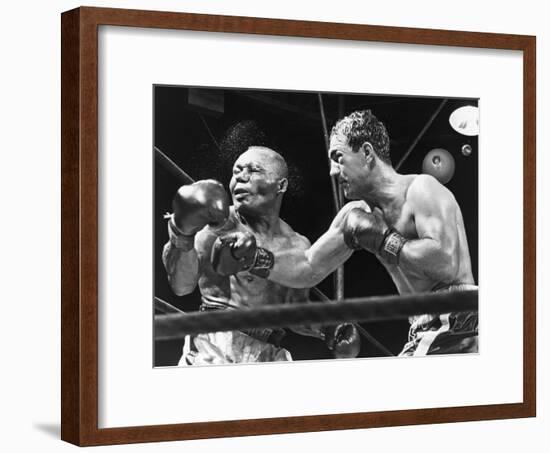 Rocky Marciano Landing a Punch on Jersey Joe Walcott, Sept. 23, 1952-null-Framed Photo