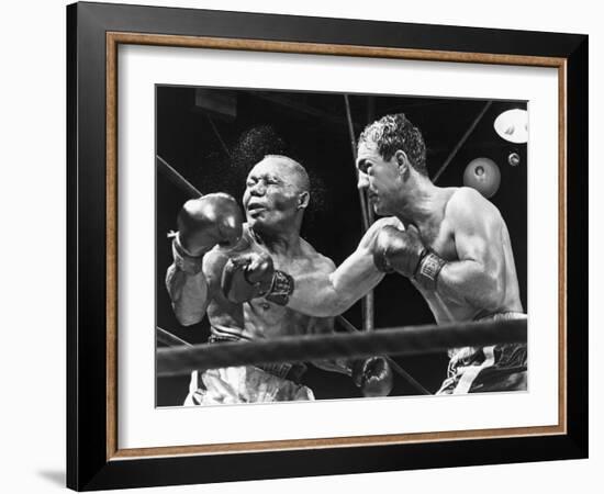 Rocky Marciano Landing a Punch on Jersey Joe Walcott, Sept. 23, 1952-null-Framed Photo