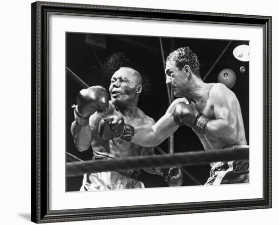 Rocky Marciano Landing a Punch on Jersey Joe Walcott, Sept. 23, 1952--Framed Photo