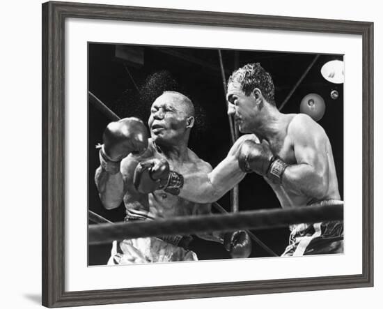 Rocky Marciano Landing a Punch on Jersey Joe Walcott, Sept. 23, 1952--Framed Photo