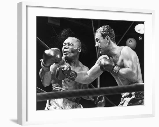 Rocky Marciano Landing a Punch on Jersey Joe Walcott, Sept. 23, 1952--Framed Photo