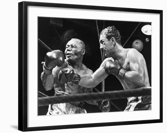 Rocky Marciano Landing a Punch on Jersey Joe Walcott, Sept. 23, 1952--Framed Photo