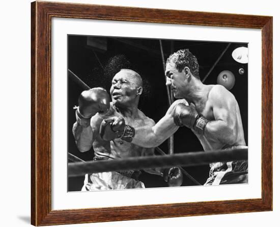 Rocky Marciano Landing a Punch on Jersey Joe Walcott, Sept. 23, 1952-null-Framed Photo