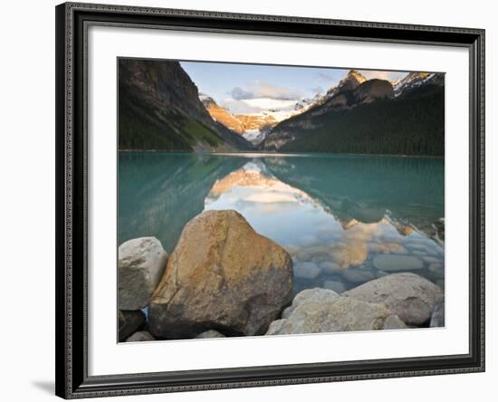 Rocky Mountains and boulders reflected in Lake Louise, Banff National Park, Alberta, Canada-Larry Ditto-Framed Photographic Print