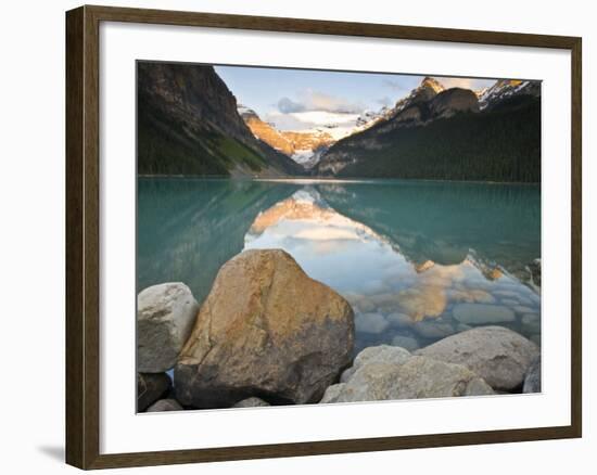 Rocky Mountains and boulders reflected in Lake Louise, Banff National Park, Alberta, Canada-Larry Ditto-Framed Photographic Print