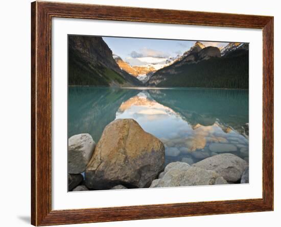 Rocky Mountains and boulders reflected in Lake Louise, Banff National Park, Alberta, Canada-Larry Ditto-Framed Photographic Print