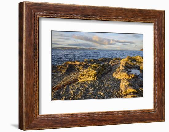 Rocky shore near Catacol looking out across the Kilbrannan Sound to Mull of Kintyre, Isle of Arran,-Gary Cook-Framed Photographic Print