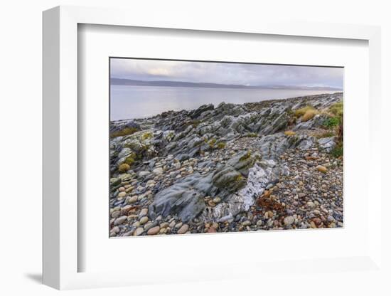 Rocky shore near Pirnmill looking out across the Kilbrannan Sound to Mull of Kintyre, Isle of Arran-Gary Cook-Framed Photographic Print