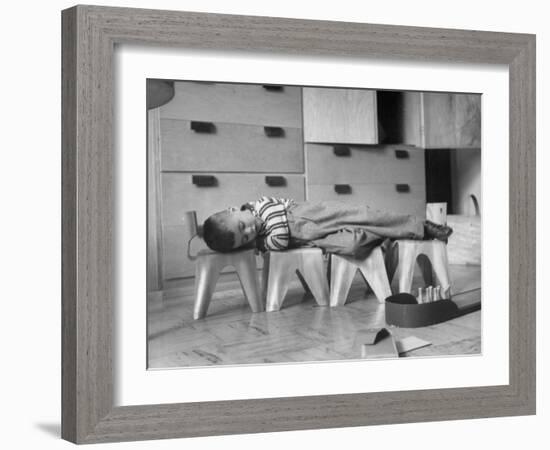 Rocky Stensrud, Jr., Using Children's Chairs in a Home to Make a Train Upon Which He Can Sleep-Joe Scherschel-Framed Photographic Print