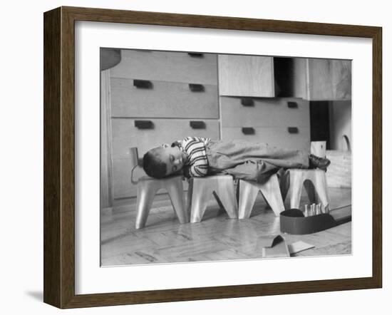 Rocky Stensrud, Jr., Using Children's Chairs in a Home to Make a Train Upon Which He Can Sleep-Joe Scherschel-Framed Photographic Print