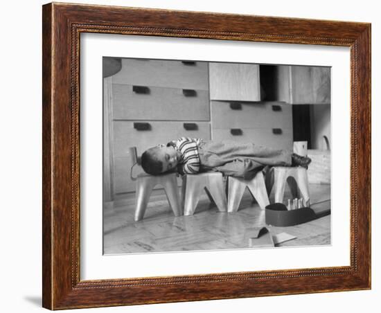 Rocky Stensrud, Jr., Using Children's Chairs in a Home to Make a Train Upon Which He Can Sleep-Joe Scherschel-Framed Photographic Print