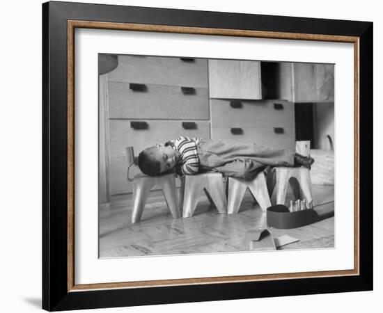 Rocky Stensrud, Jr., Using Children's Chairs in a Home to Make a Train Upon Which He Can Sleep-Joe Scherschel-Framed Photographic Print