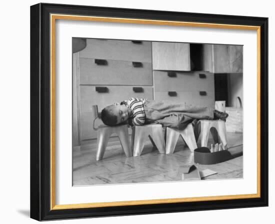 Rocky Stensrud, Jr., Using Children's Chairs in a Home to Make a Train Upon Which He Can Sleep-Joe Scherschel-Framed Photographic Print