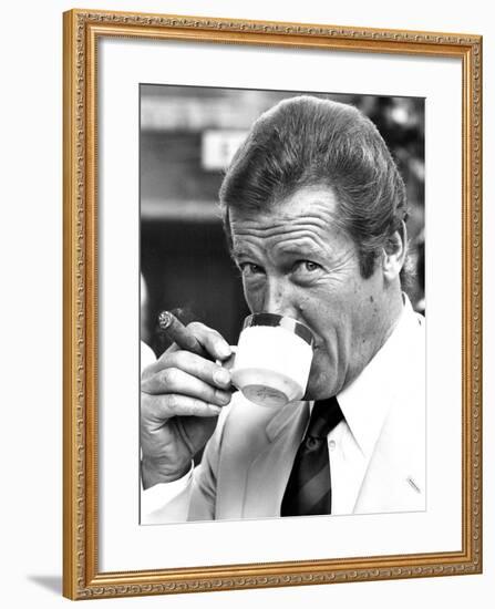 Roger Moore Drinking Coffee-Associated Newspapers-Framed Photo