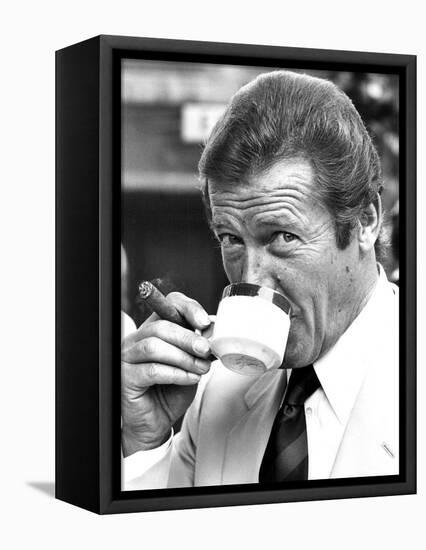 Roger Moore Drinking Coffee-Associated Newspapers-Framed Stretched Canvas