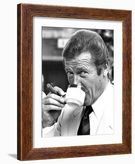 Roger Moore Drinking Coffee-Associated Newspapers-Framed Photo
