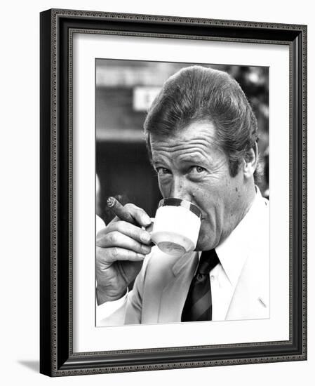 Roger Moore Drinking Coffee-Associated Newspapers-Framed Photo