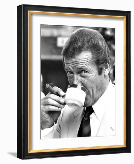 Roger Moore Drinking Coffee-Associated Newspapers-Framed Photo