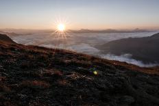 Mountaineer Admires Sunrise and Sunrays-Rolf Roeckl-Photographic Print