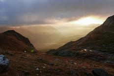 Mountaineer Admires Sunrise and Sunrays-Rolf Roeckl-Photographic Print