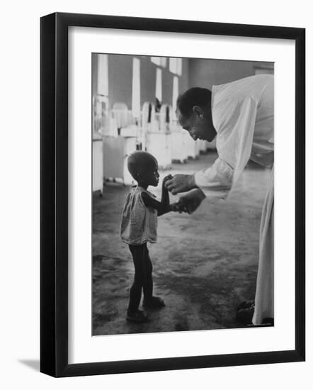 Roman Catholic Priest Chatting with Healing Child-Terence Spencer-Framed Photographic Print