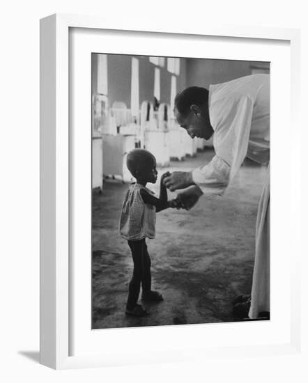 Roman Catholic Priest Chatting with Healing Child-Terence Spencer-Framed Photographic Print