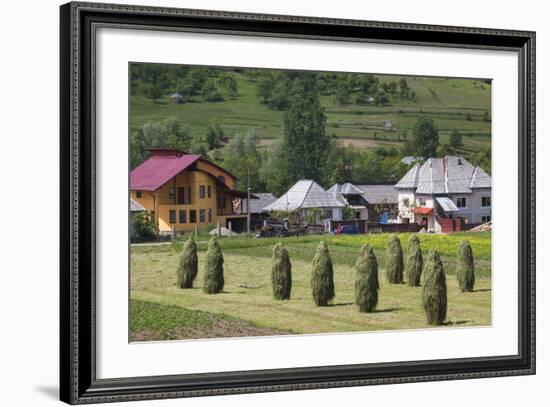 Romania, Maramures Region, Rona de Jos, Village View with Haystacks-Walter Bibikow-Framed Photographic Print