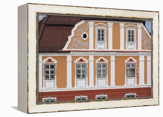 Romania, Transylvania, Sibiu, Piata Mare Square, Building Detail-Walter Bibikow-Framed Premier Image Canvas