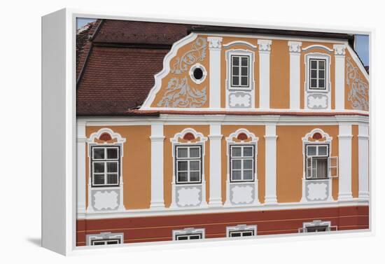 Romania, Transylvania, Sibiu, Piata Mare Square, Building Detail-Walter Bibikow-Framed Premier Image Canvas