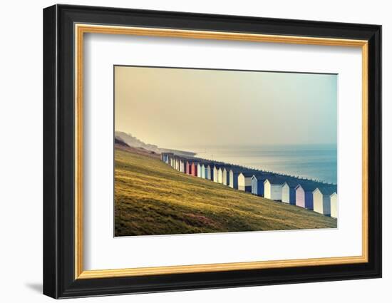 Row of Colored Beach Huts with Stormy Blue Sky on the Beach of Tankerton near Whitstable in Kent, U-melis-Framed Photographic Print