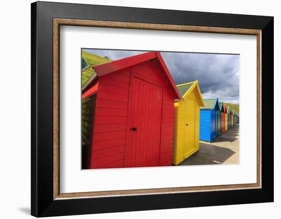 Row of Colourful Beach Huts and their Shadows, with Grassy Cliffs, West Cliff Beach-Eleanor Scriven-Framed Photographic Print