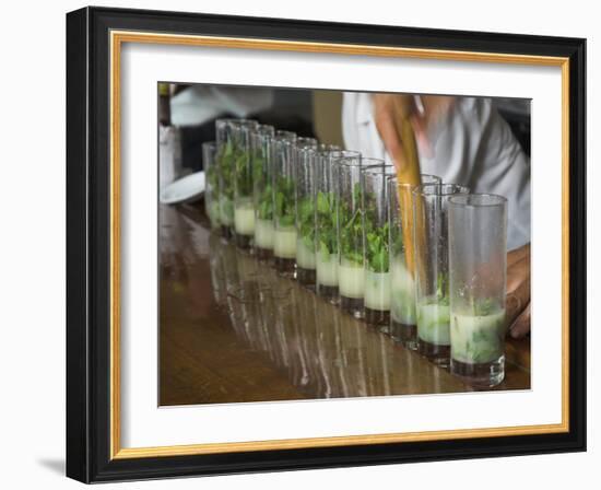 Row of Glasses on a Bar with Barman Preparing Mojito Cocktails, Habana Vieja, Havana, Cuba-Eitan Simanor-Framed Photographic Print