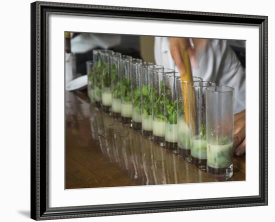 Row of Glasses on a Bar with Barman Preparing Mojito Cocktails, Habana Vieja, Havana, Cuba-Eitan Simanor-Framed Photographic Print