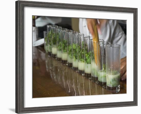 Row of Glasses on a Bar with Barman Preparing Mojito Cocktails, Habana Vieja, Havana, Cuba-Eitan Simanor-Framed Photographic Print