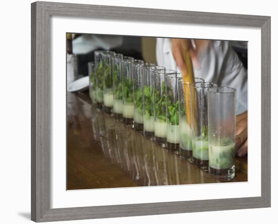 Row of Glasses on a Bar with Barman Preparing Mojito Cocktails, Habana Vieja, Havana, Cuba-Eitan Simanor-Framed Photographic Print