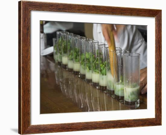 Row of Glasses on a Bar with Barman Preparing Mojito Cocktails, Habana Vieja, Havana, Cuba-Eitan Simanor-Framed Photographic Print