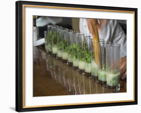 Row of Glasses on a Bar with Barman Preparing Mojito Cocktails, Habana Vieja, Havana, Cuba-Eitan Simanor-Framed Photographic Print