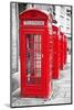 Row Of Iconic London Red Phone Cabins With The Rest Of The Picture In Black And White-Kamira-Mounted Photographic Print