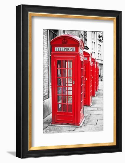 Row Of Iconic London Red Phone Cabins With The Rest Of The Picture In Black And White-Kamira-Framed Photographic Print