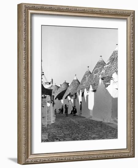 Row of Trulli Homes Made from Limestone Boulders and Feature Conical or Domed Roofs-Alfred Eisenstaedt-Framed Photographic Print
