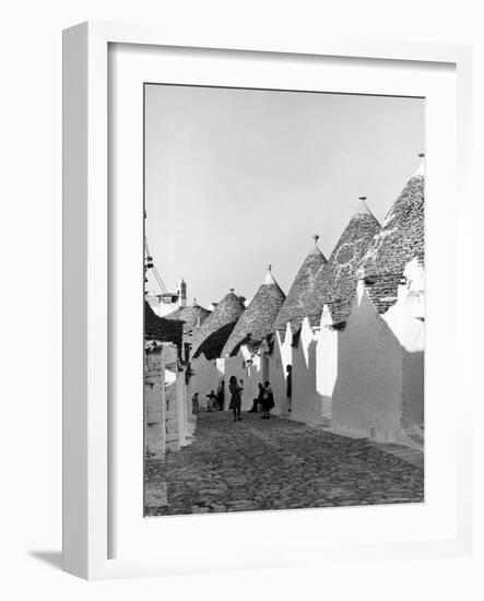 Row of Trulli Homes Made from Limestone Boulders and Feature Conical or Domed Roofs-Alfred Eisenstaedt-Framed Photographic Print