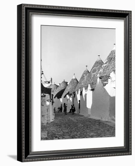 Row of Trulli Homes Made from Limestone Boulders and Feature Conical or Domed Roofs-Alfred Eisenstaedt-Framed Photographic Print