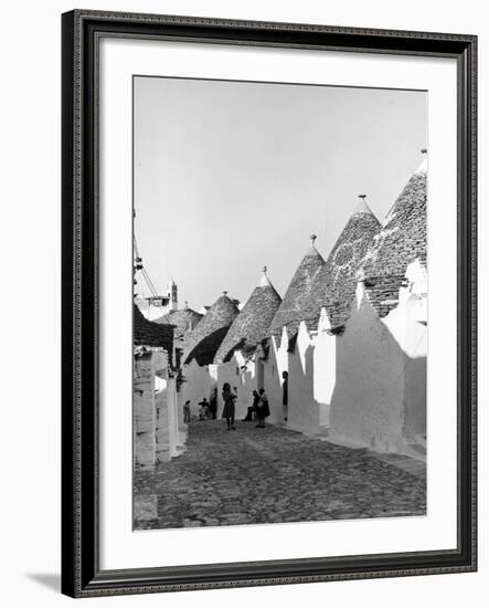 Row of Trulli Homes Made from Limestone Boulders and Feature Conical or Domed Roofs-Alfred Eisenstaedt-Framed Photographic Print