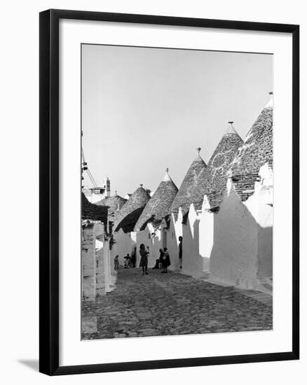 Row of Trulli Homes Made from Limestone Boulders and Feature Conical or Domed Roofs-Alfred Eisenstaedt-Framed Photographic Print