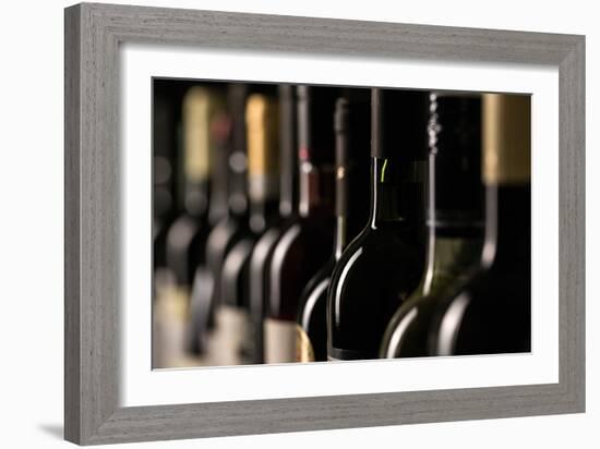 Row of Vintage Wine Bottles in a Wine Cellar (Shallow Dof; Color Toned Image)-l i g h t p o e t-Framed Photographic Print