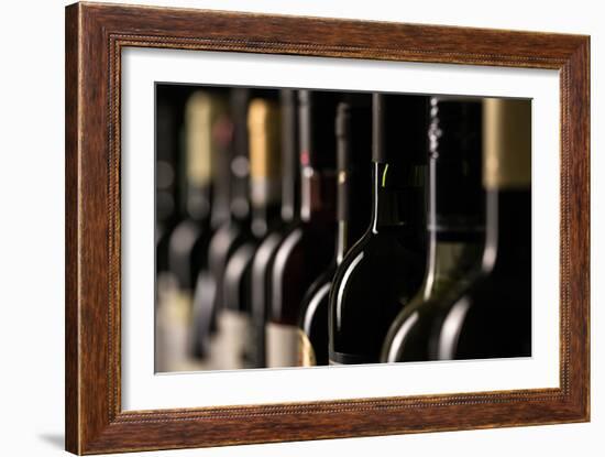 Row of Vintage Wine Bottles in a Wine Cellar (Shallow Dof; Color Toned Image)-l i g h t p o e t-Framed Photographic Print