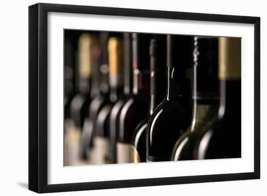 Row of Vintage Wine Bottles in a Wine Cellar (Shallow Dof; Color Toned Image)-l i g h t p o e t-Framed Photographic Print