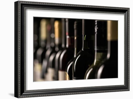 Row of Vintage Wine Bottles in a Wine Cellar (Shallow Dof; Color Toned Image)-l i g h t p o e t-Framed Photographic Print